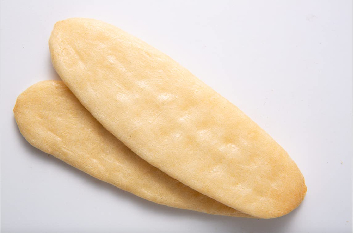 Baby Mum-Mum Hot-Kid Rusks in hand showing no-mess dissolvable feature.