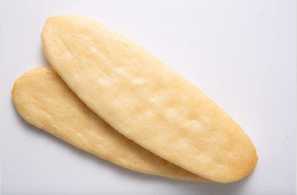 Baby Mum-Mum Hot-Kid Rusks in hand showing no-mess dissolvable feature.