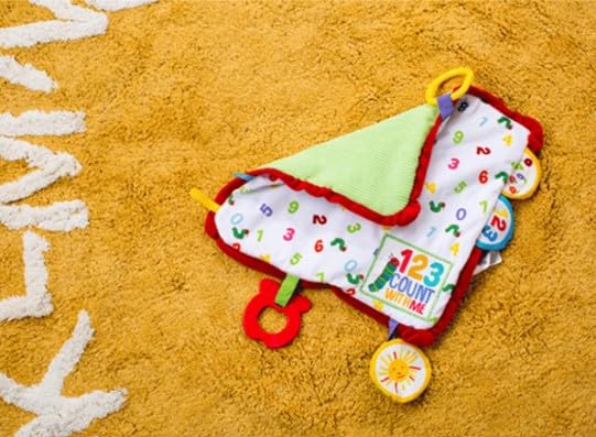Very Hungry Caterpillar blanket travel clip attached to stroller for on-the-go fun