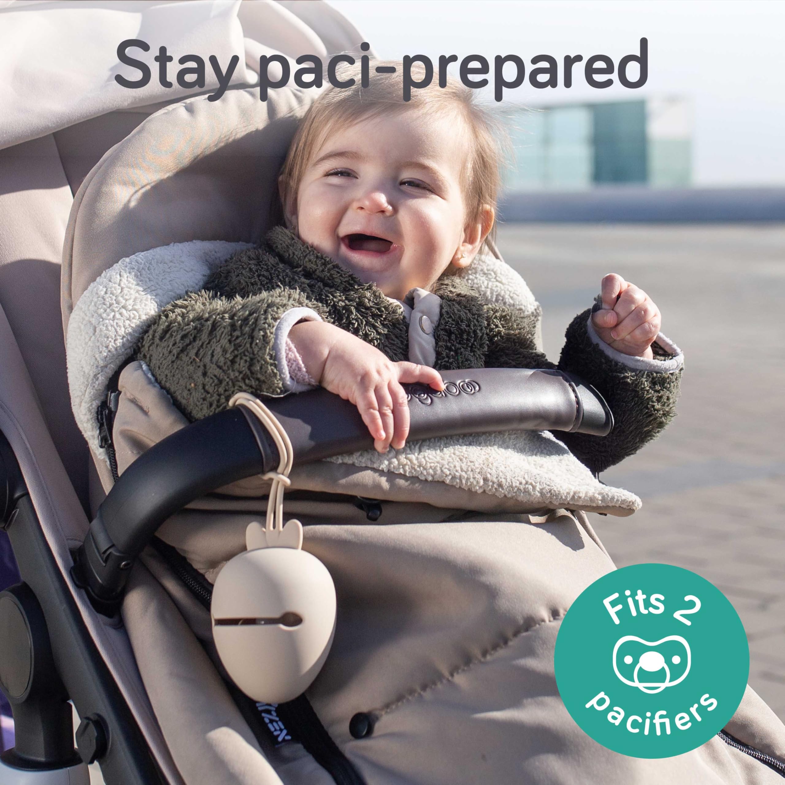 Baby Uma pacifier holder case hanging from stroller for easy reach