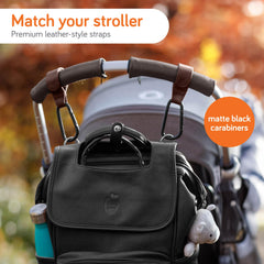 Baby Uma stroller hook clip with carabiner demonstrates 11 lb capacity.