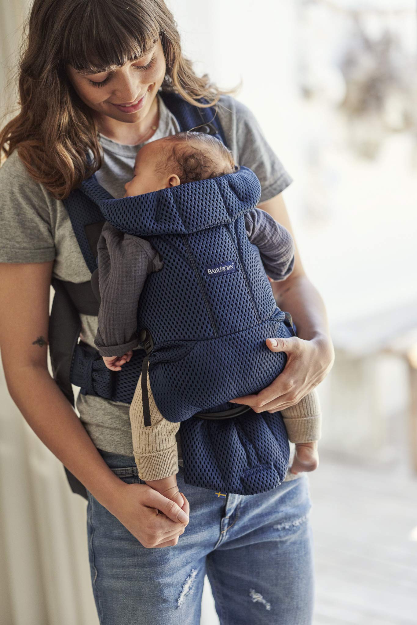 Carrier Free head support is adjustable for growing baby.