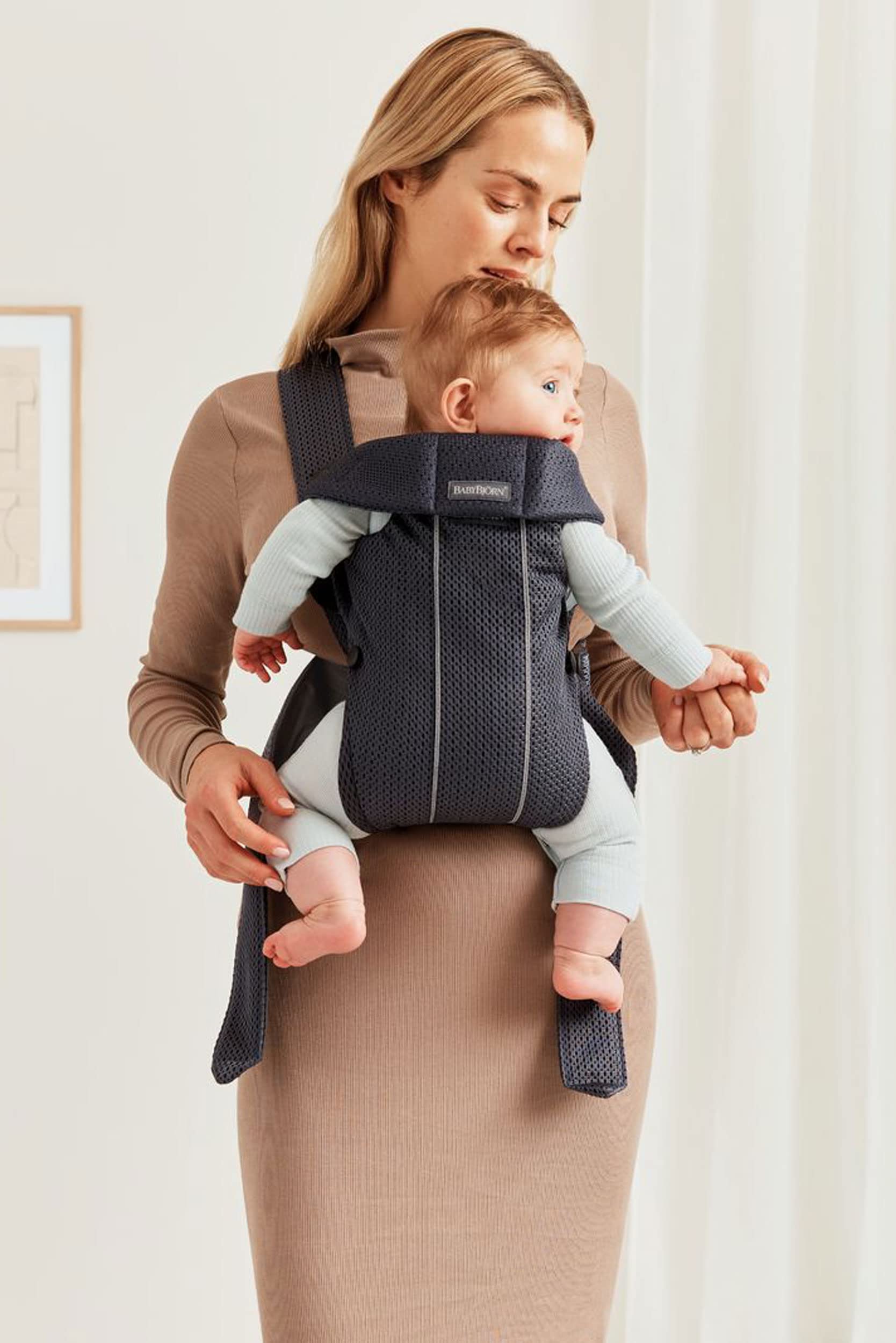 BabyBjörn Baby Carrier Mini back view highlights ergonomic support for growing baby.