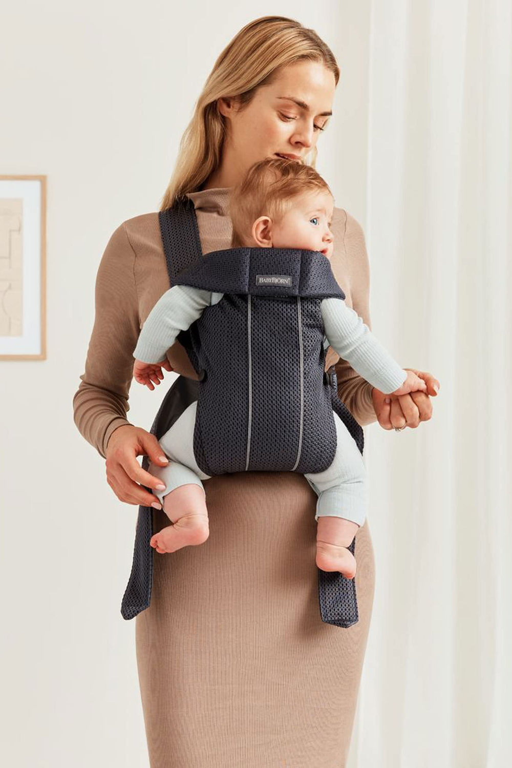 BabyBjörn Baby Carrier Mini back view highlights ergonomic support for growing baby.