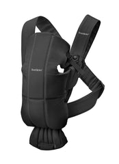 BabyBjörn Baby Carrier Mini black woven close-up shows soft fabric for close contact.