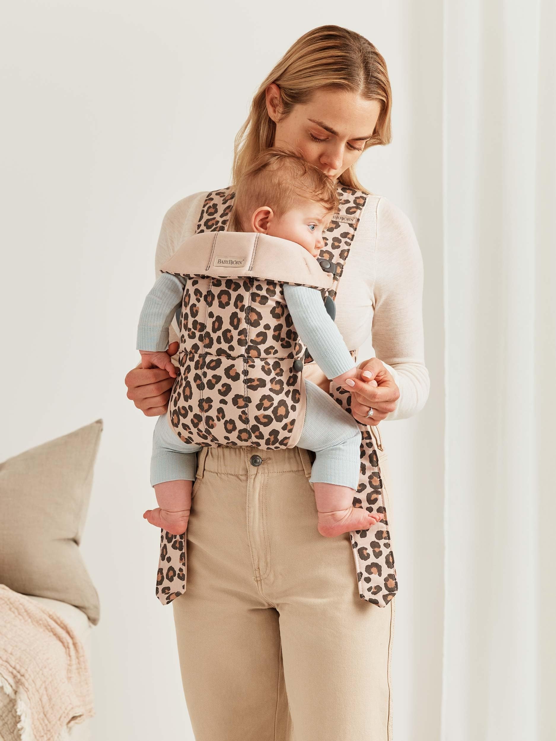 BabyBjörn Baby Carrier Mini close-up fabric emphasizes soft cotton and snug feel