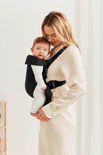 BabyBjörn Baby Carrier Mini worn in-facing-out position supports curiosity while staying secure.