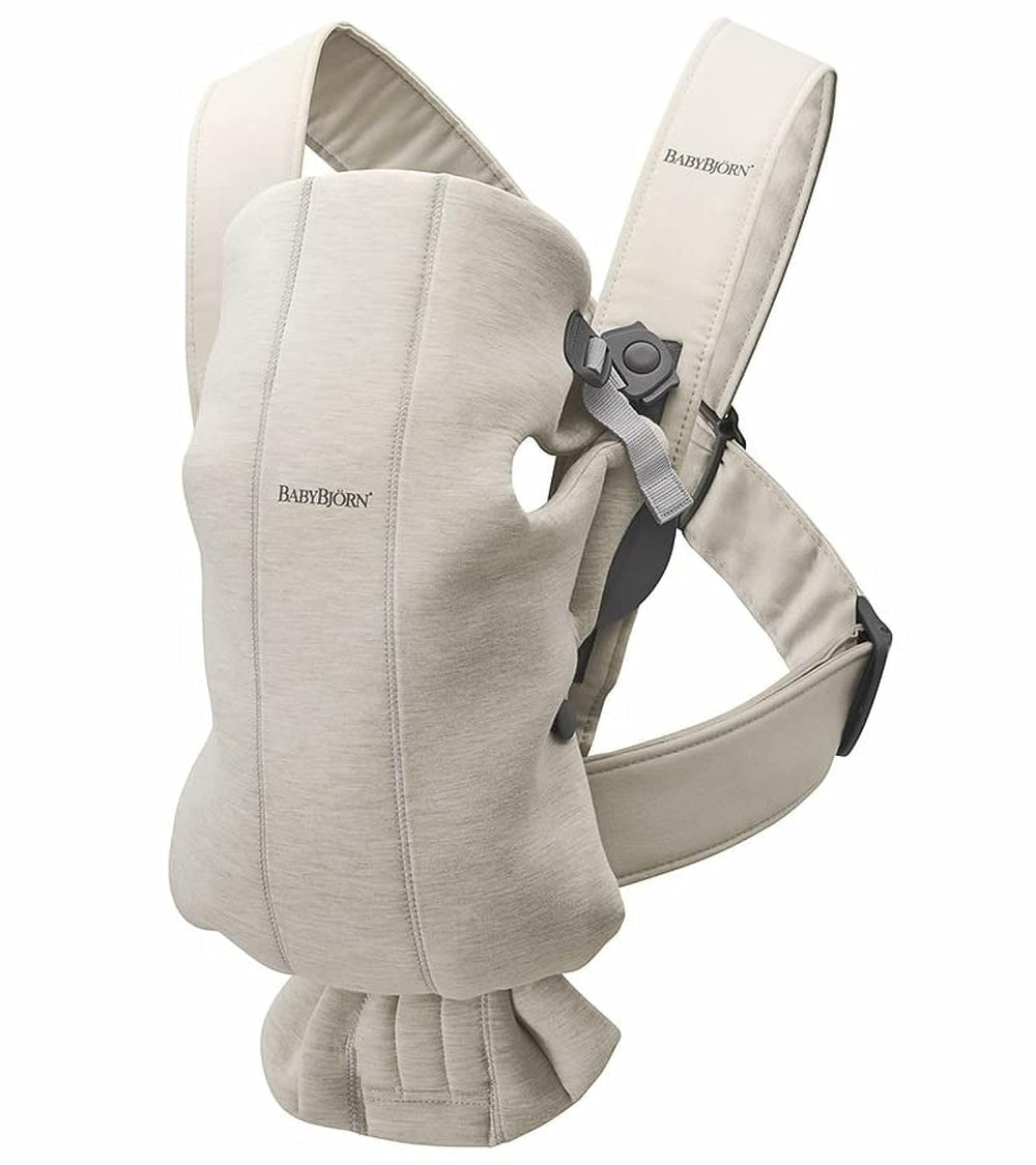 BabyBjörn Baby Carrier Mini front view in 3D Jersey light beige for cozy newborn closeness.