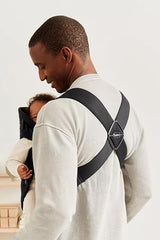 BabyBjörn Baby Carrier Mini head-support detail highlights newborn stability.