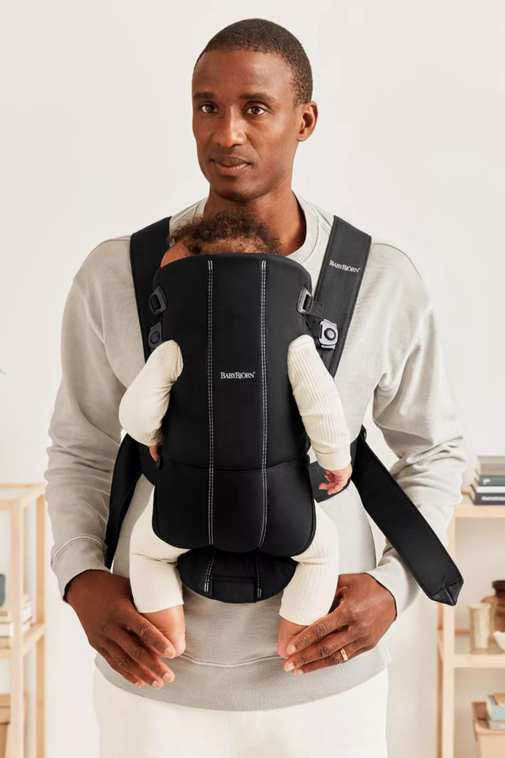 BabyBjörn Baby Carrier Mini hip-healthy label emphasizes proper hip support for growing babies.