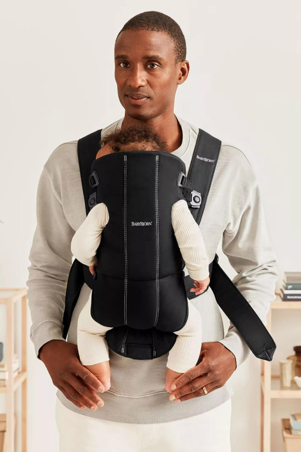 BabyBjörn Baby Carrier Mini hip-healthy label emphasizes proper hip support for growing babies.
