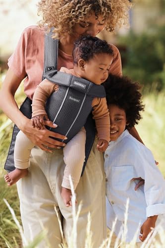 BabyBjörn Baby Carrier Mini usage scenario showing newborn bonding moments.