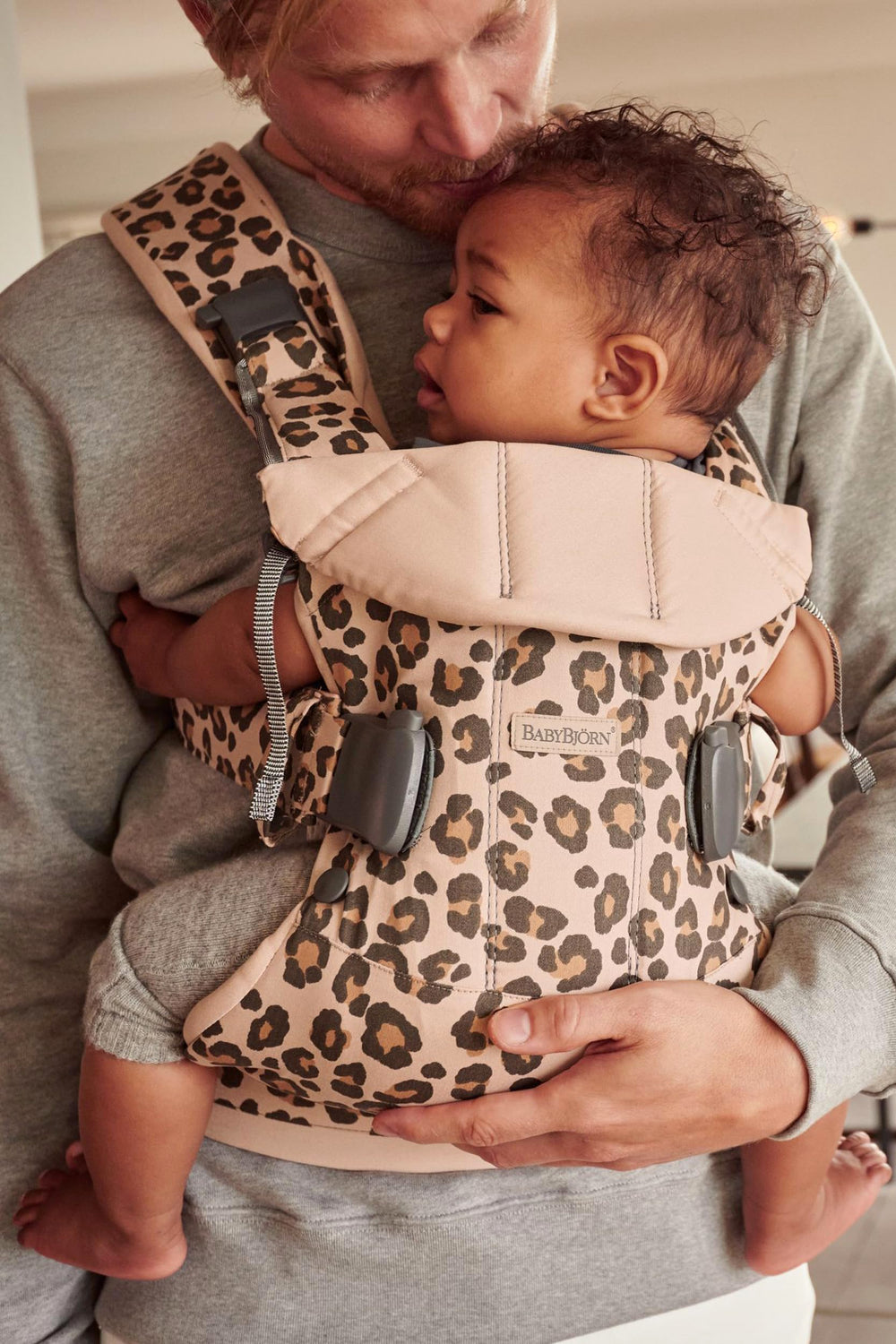 BabyBjörn Baby Carrier One, infant positioned, shows built-in newborn-friendly support.