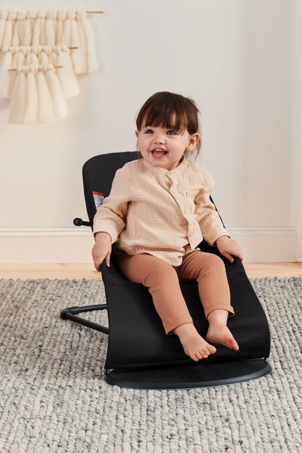 BabyBjörn Bouncer Balance Soft folds into transport mode for easy trips.