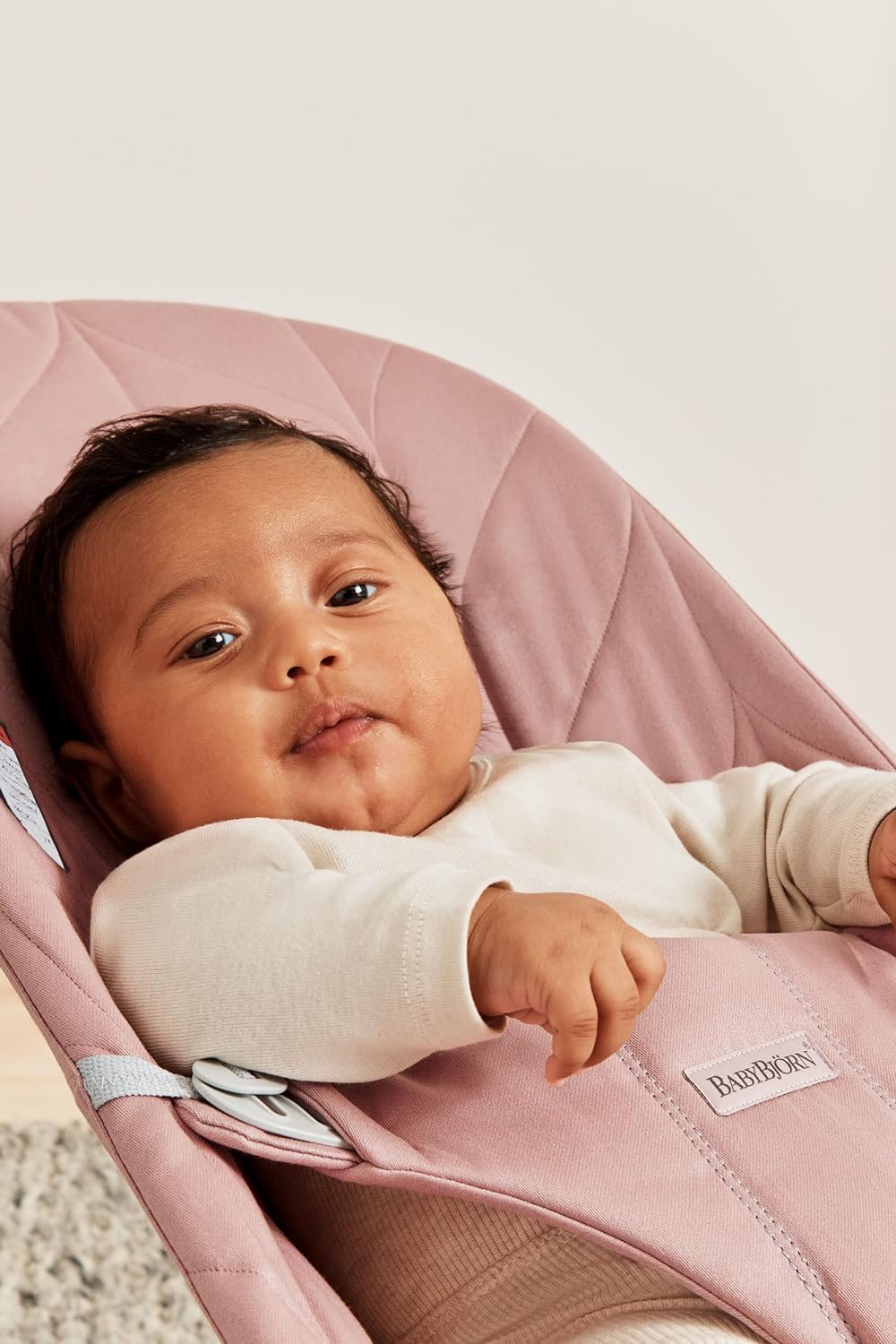 BabyBjörn Bouncer Bliss dusty pink seat converted to chair supports growing child.
