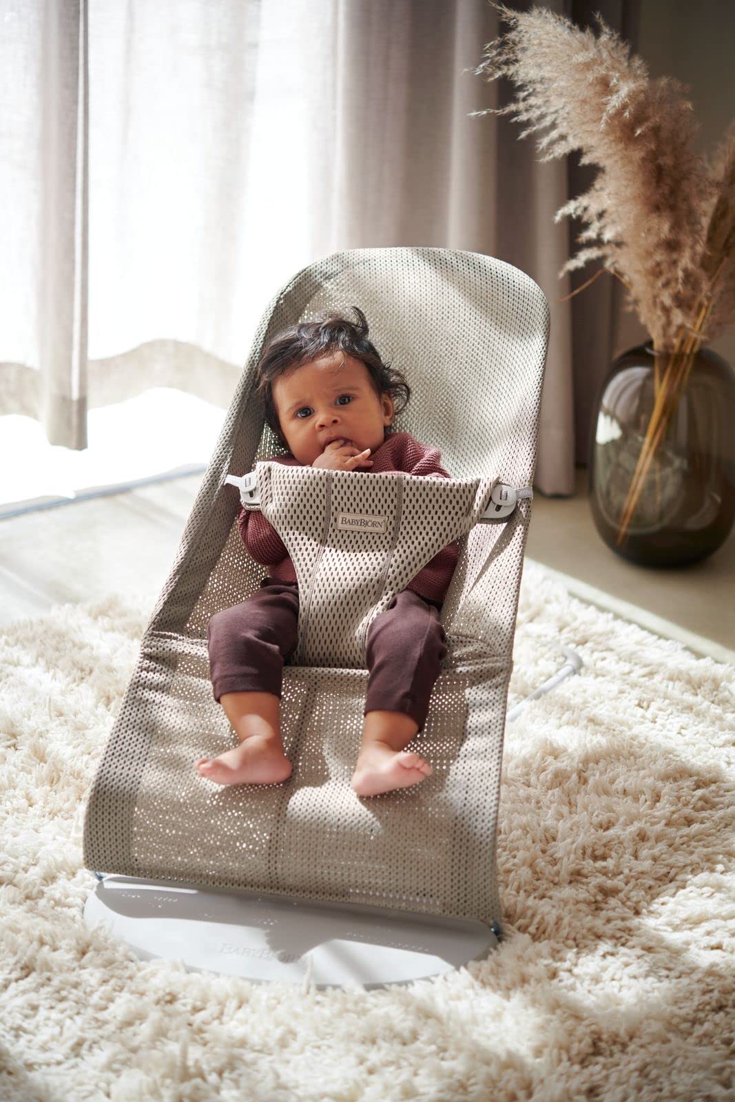 BabyBjörn Bouncer Bliss Mesh Gray Beige rocking action helps soothe and entertain.