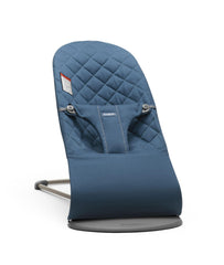 BabyBjörn Bouncer Bliss midnight blue woven fabric keeps baby close during playtime.