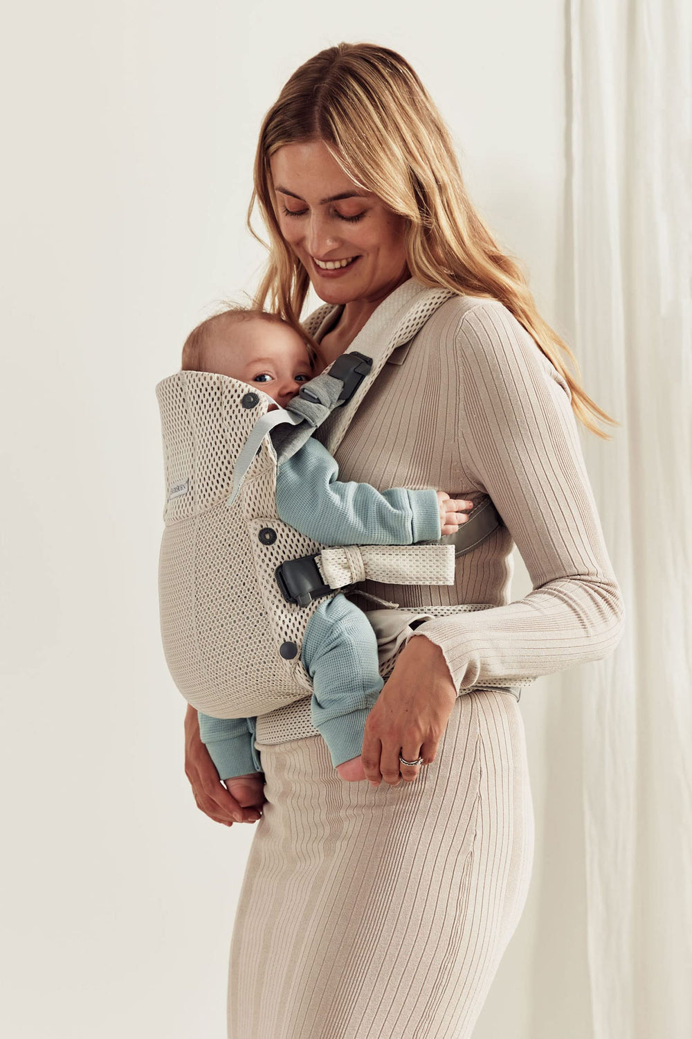 BabyBjörn Harmony back carry position demonstrates versatile carrying options.
