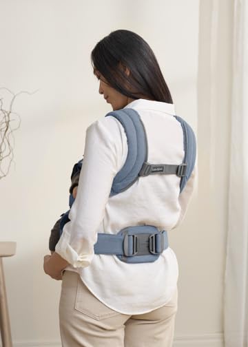 BabyBjörn Harmony blue back carry demonstrates hands-free versatility.