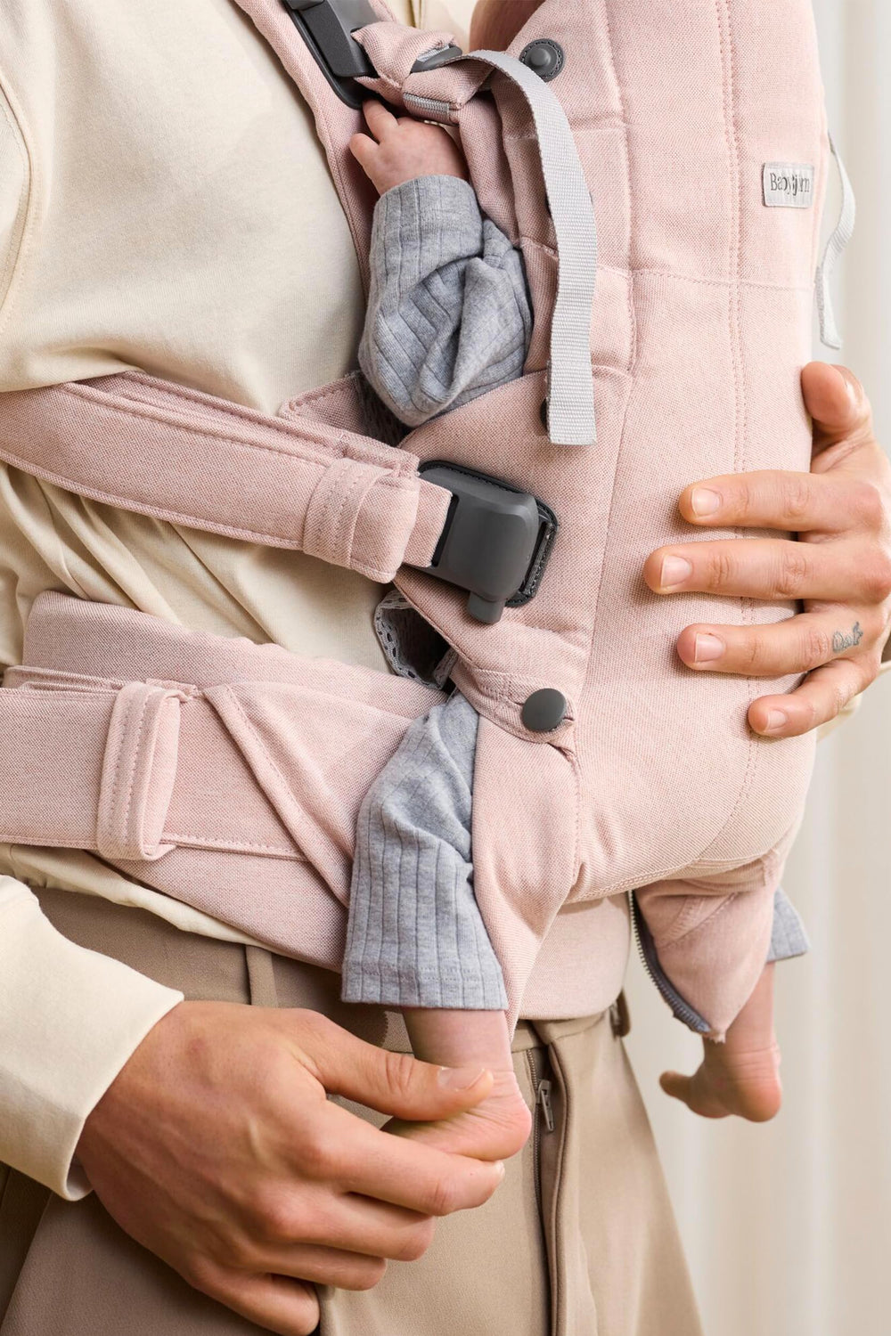 BabyBjörn Harmony outward-facing option shows toddler exploration while secure.