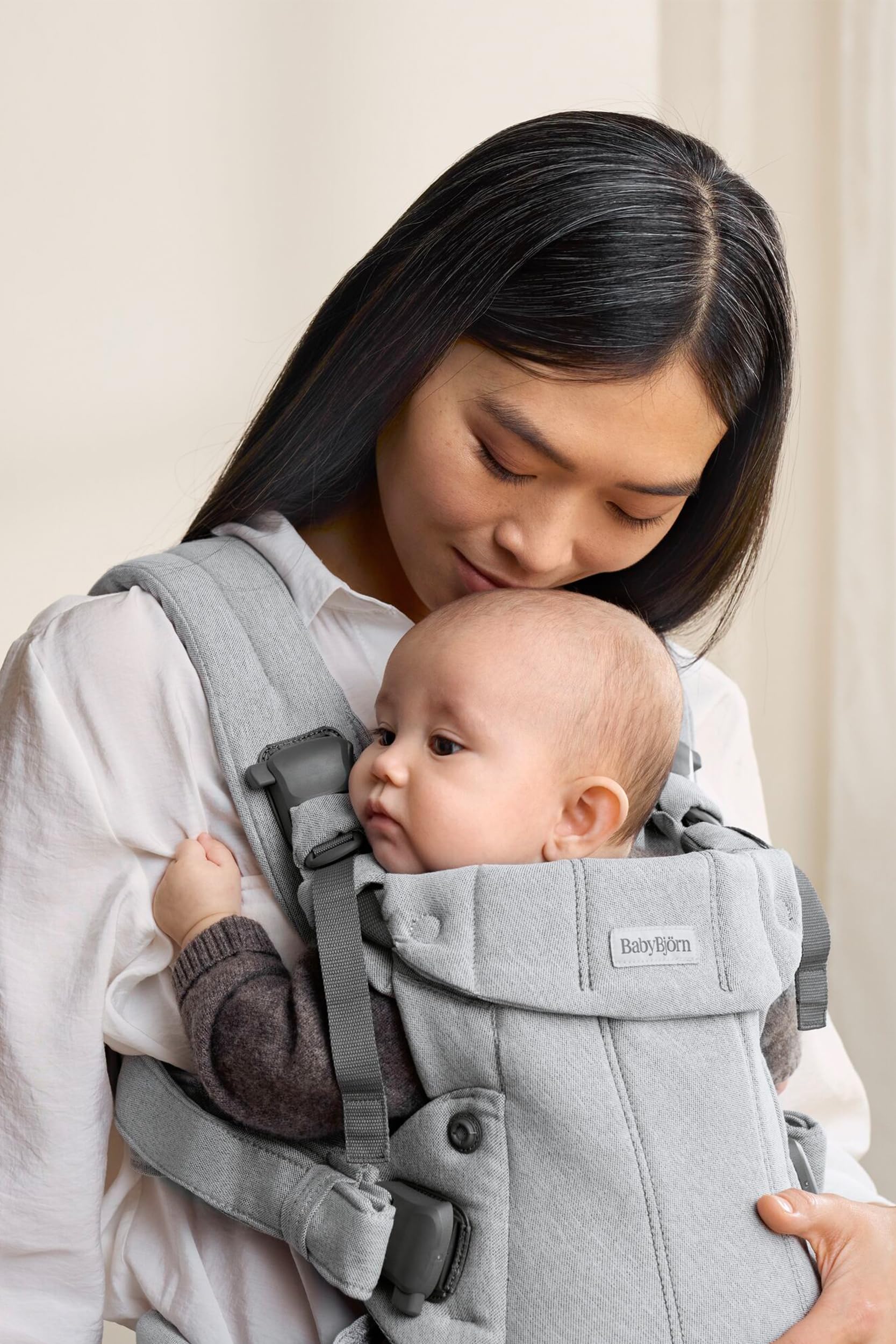 BabyBjörn Harmony four positions depict newborn to toddler carrying versatility