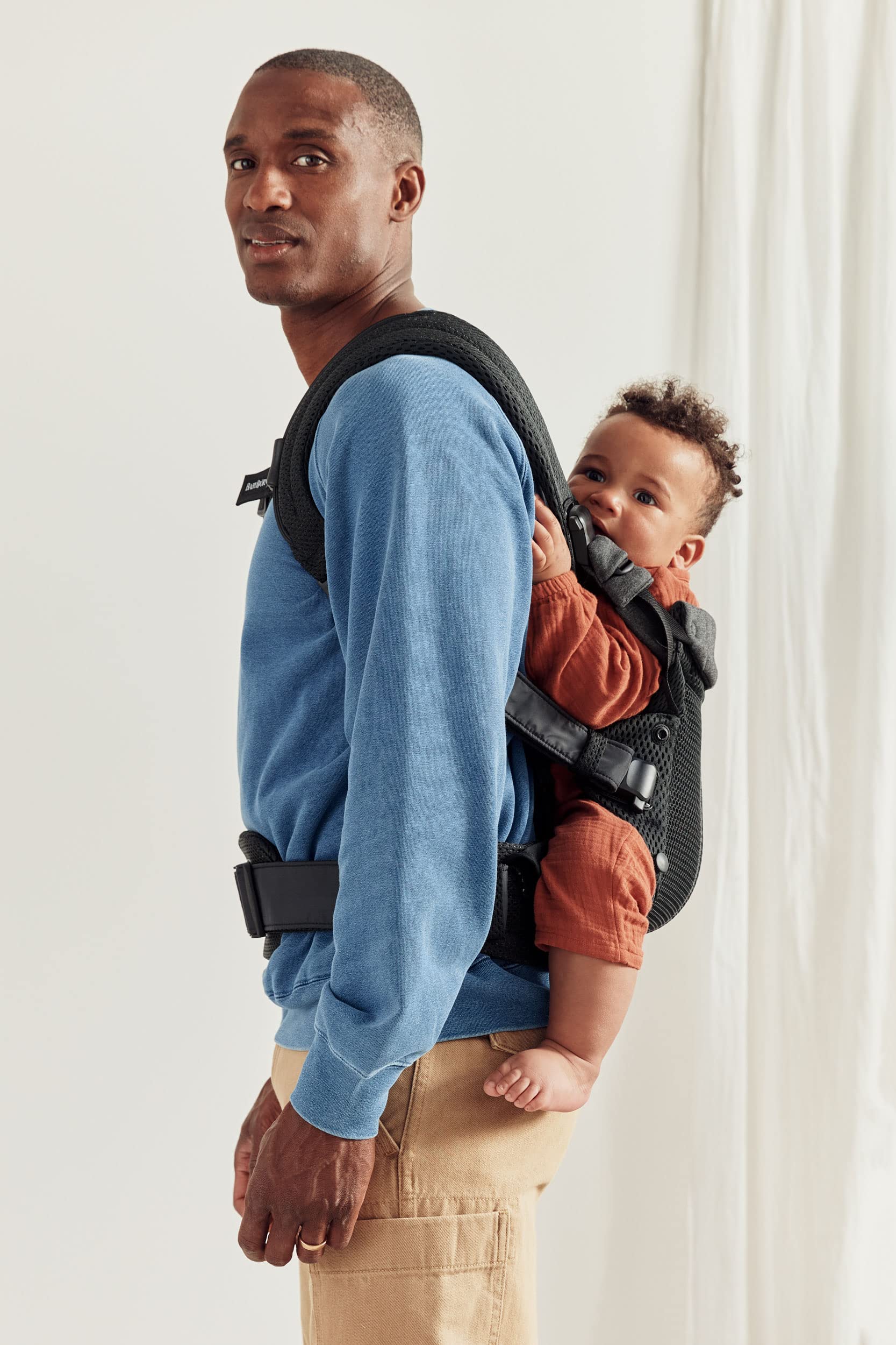 BabyBjörn Harmony four positions including newborn facing in, facing out, and back carry.