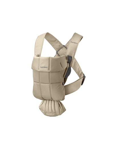 BabyBjörn Baby Carrier Mini beige woven newborn snug view demonstrates easy-to-use design.