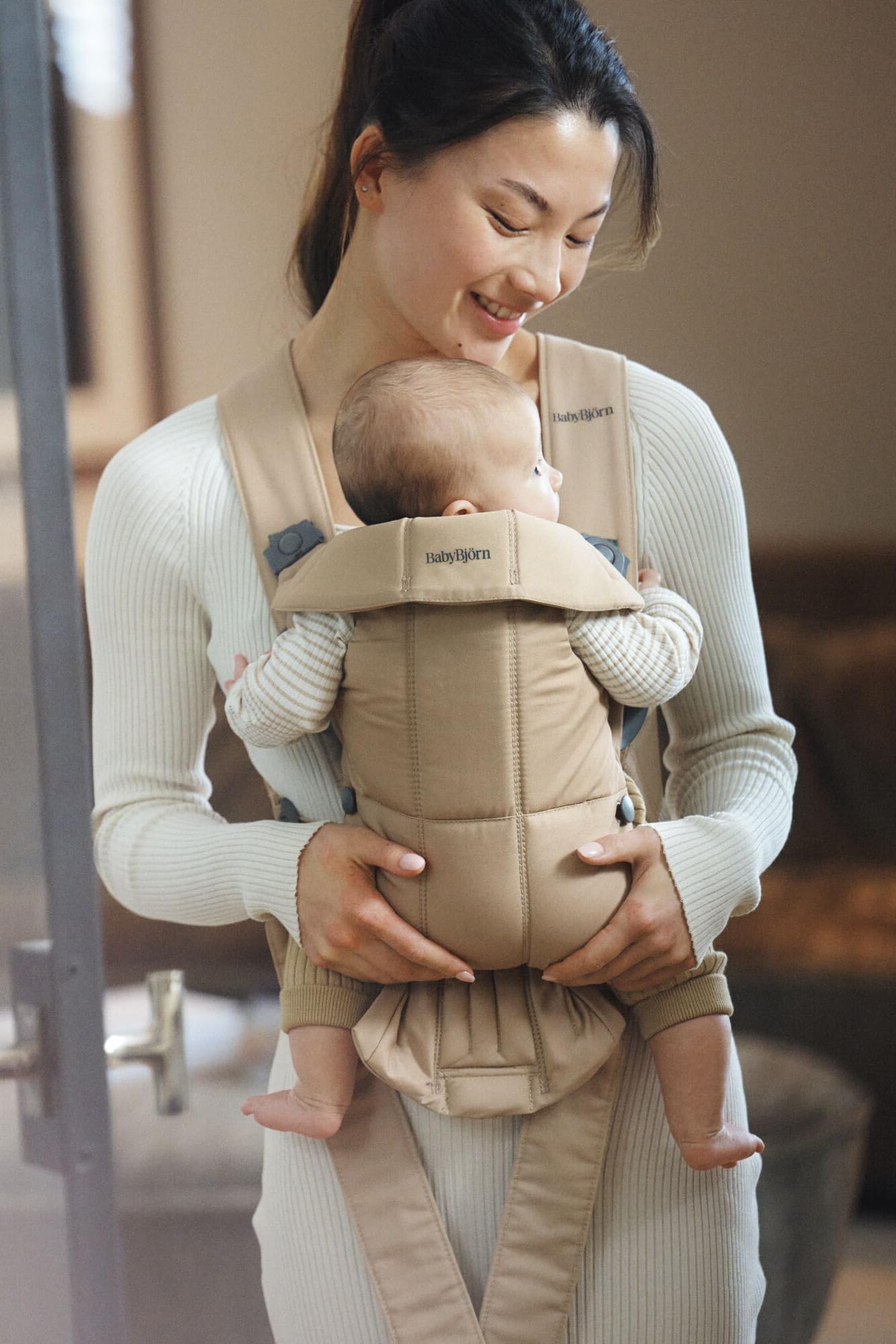 BabyBjörn Baby Carrier Mini facing-out position at five months enables extended view.
