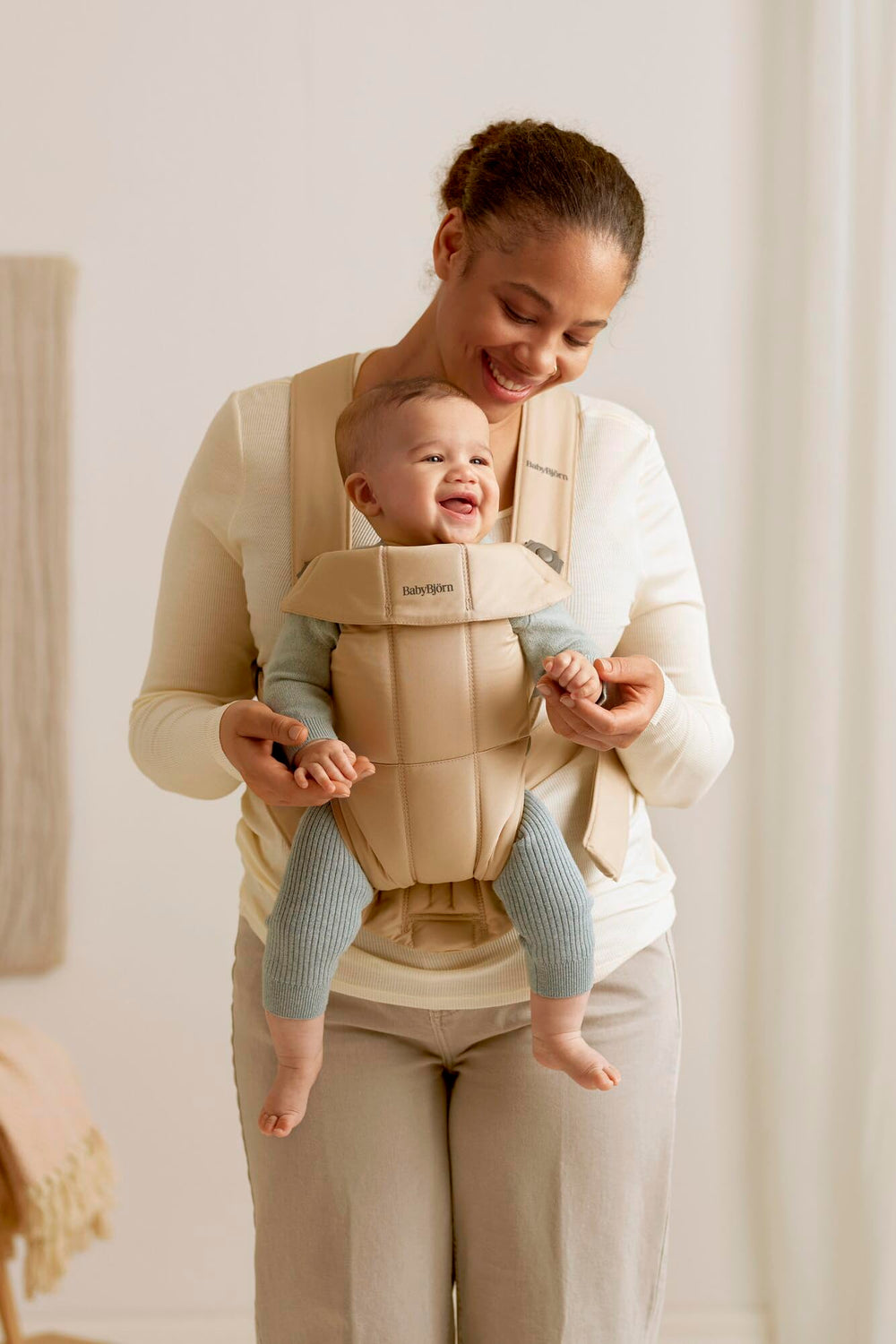 BabyBjörn Baby Carrier Mini soft-woven blend close-up shows versatile fabric options.