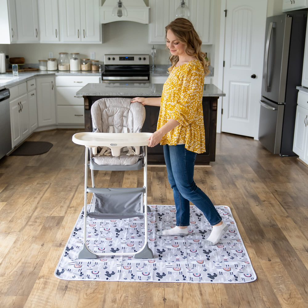 BABYBOET Splat Mat folded for storage; messes contained for easy cleanup