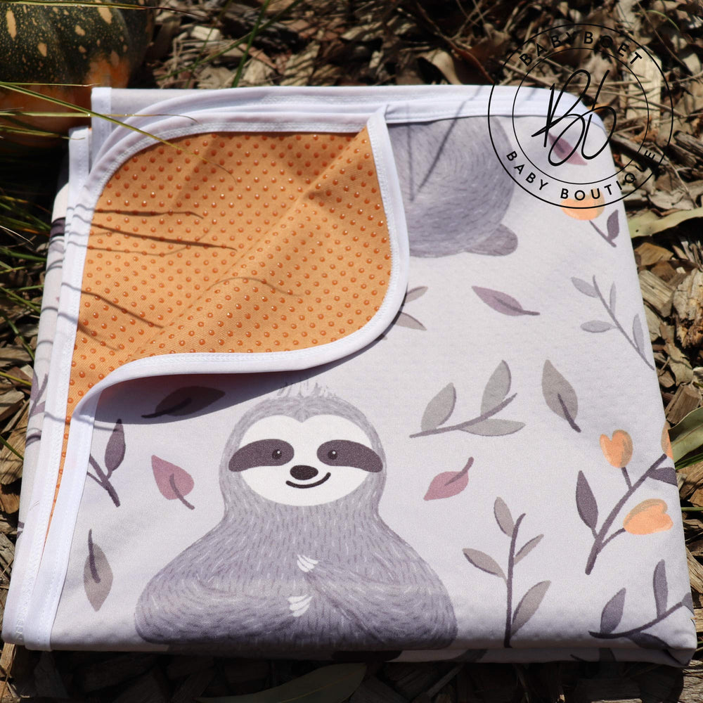 Babyboet Splat Mat doubles as a toddler play mat for park or home.