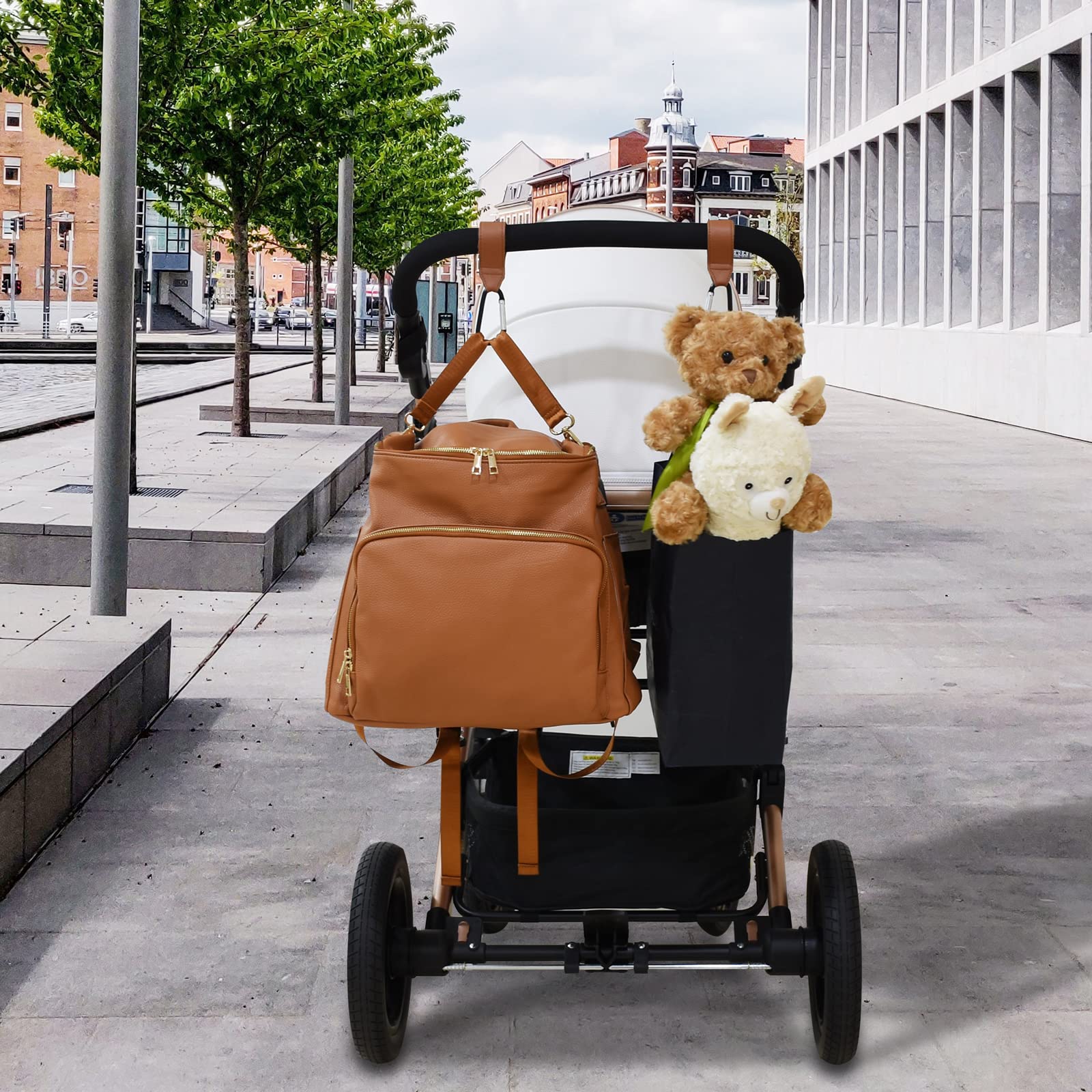 Babyfond hook attached to stroller handle during a stroll