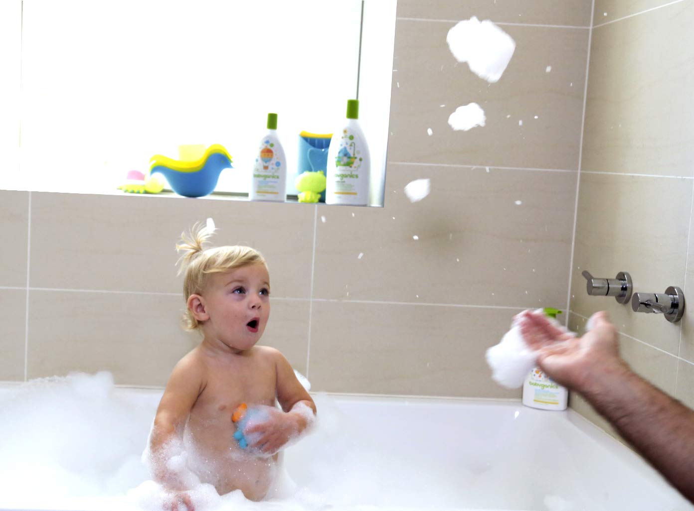 Babyganics head-to-toe cleanser used during bath time with bubbles