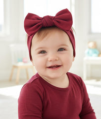 BABYGIZ headband maroon on baby demonstrates secure fit for crawling and play