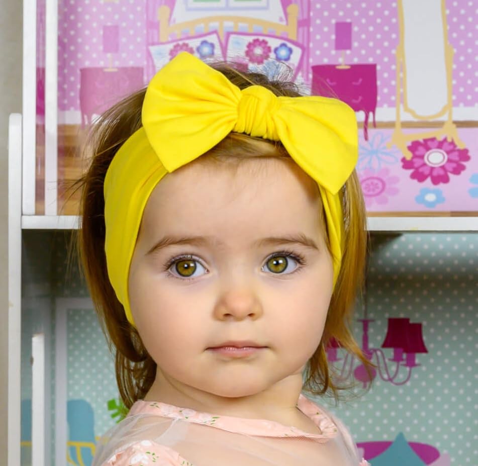 BABYGIZ headband with yellow bow for travel and outings.
