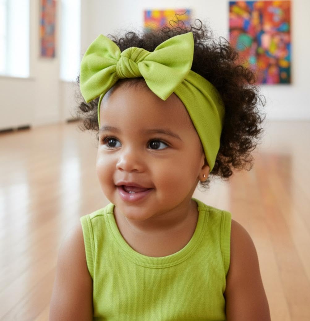Babygiz headband closeup shows soft cotton blend and non-slip bow design for gentle wear.