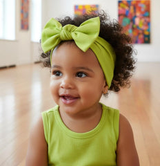 Babygiz headband closeup shows soft cotton blend and non-slip bow design for gentle wear.