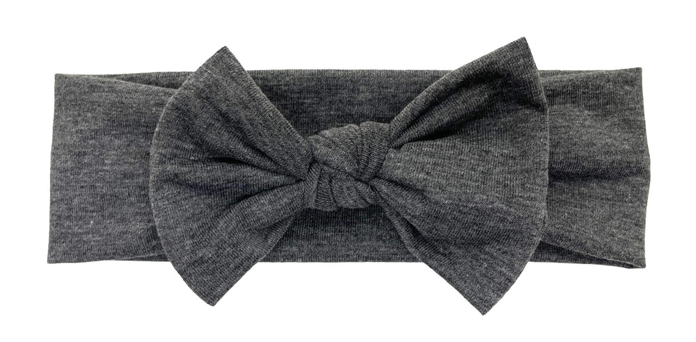 BABYGIZ headband worn during infant photography illustrates a charming prop option.