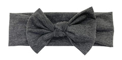 BABYGIZ headband worn during infant photography illustrates a charming prop option.
