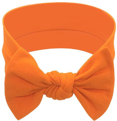 BABYGIZ headband orange-bow on newborn girl highlighting comfy fit.