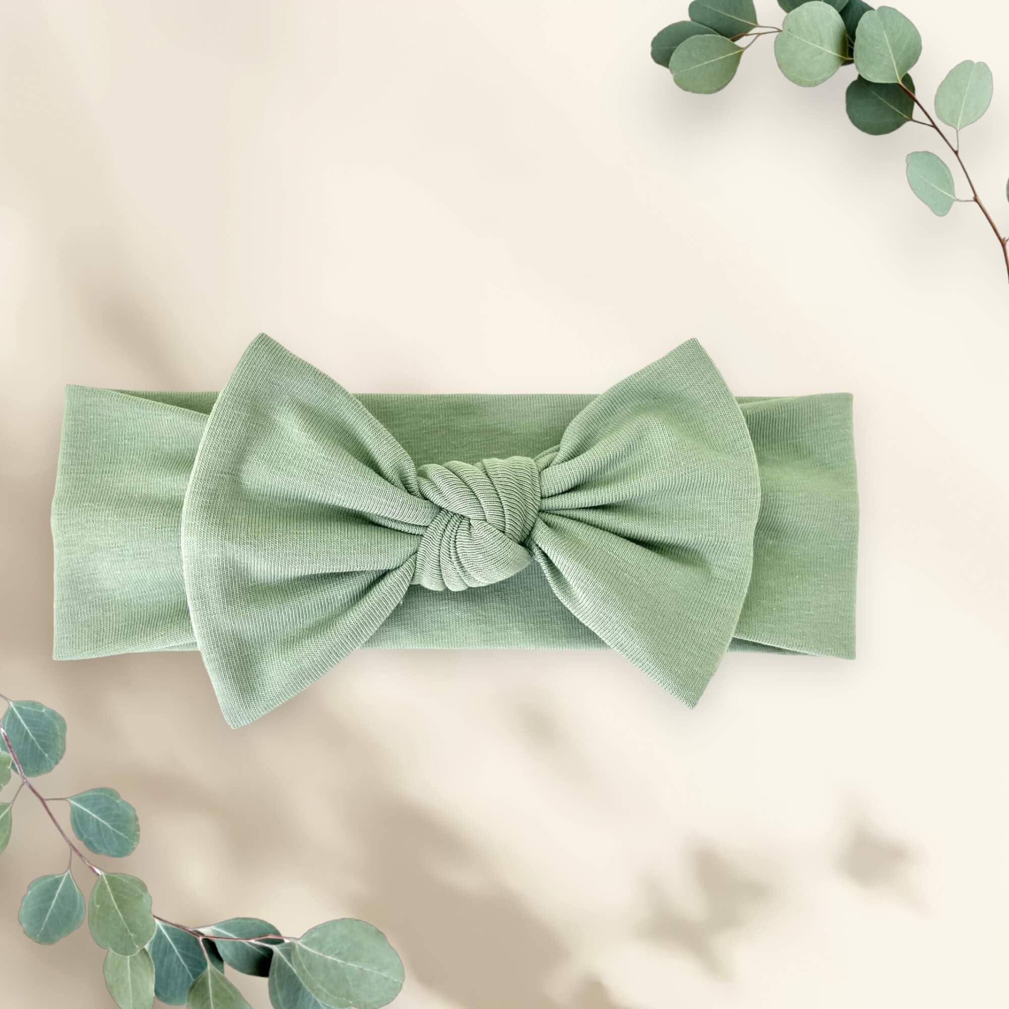 BABYGIZ Linden Green headband on baby during daily activities.