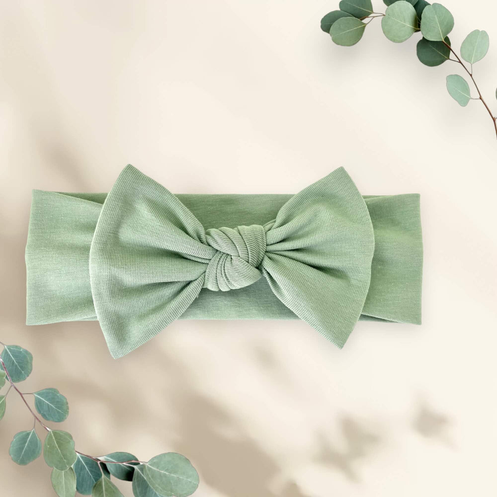 BABYGIZ Linden Green headband on baby during daily activities.