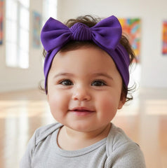 Babygiz soft cotton headband in hand—gentle stretch for comfy wear.