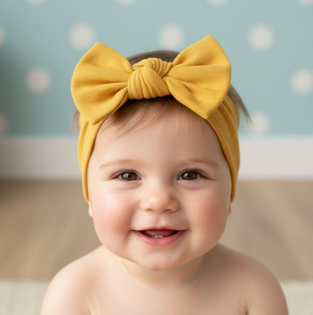 Babygiz stretchy cotton headband mustard-wear demonstrates secure, gentle fit for 3–36 month olds.
