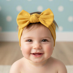 Babygiz stretchy cotton headband mustard-wear demonstrates secure, gentle fit for 3–36 month olds.