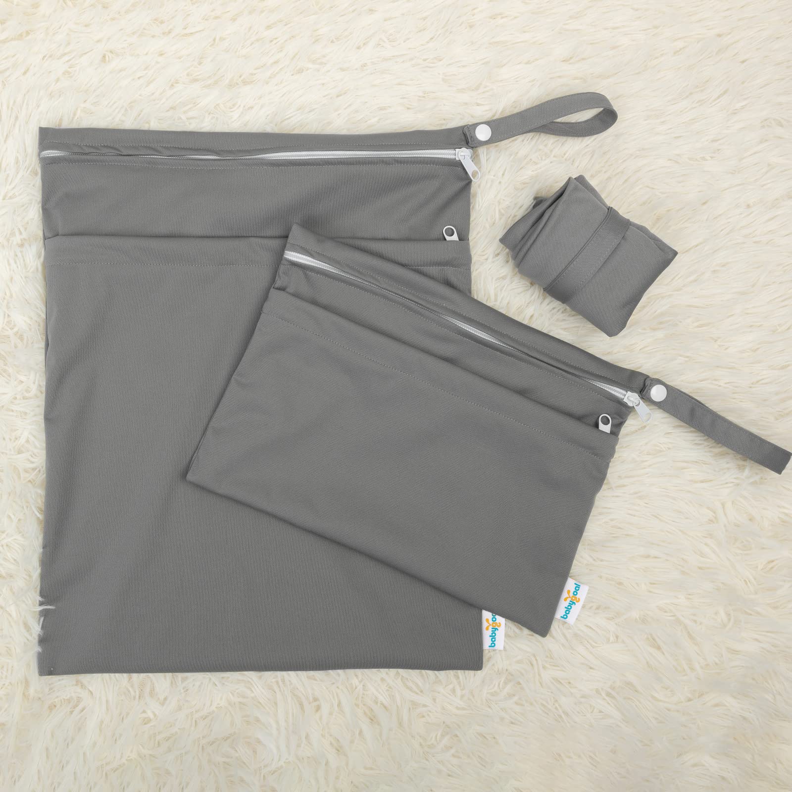 Babygoal wet bag with snap handle ready to hang on stroller or door.