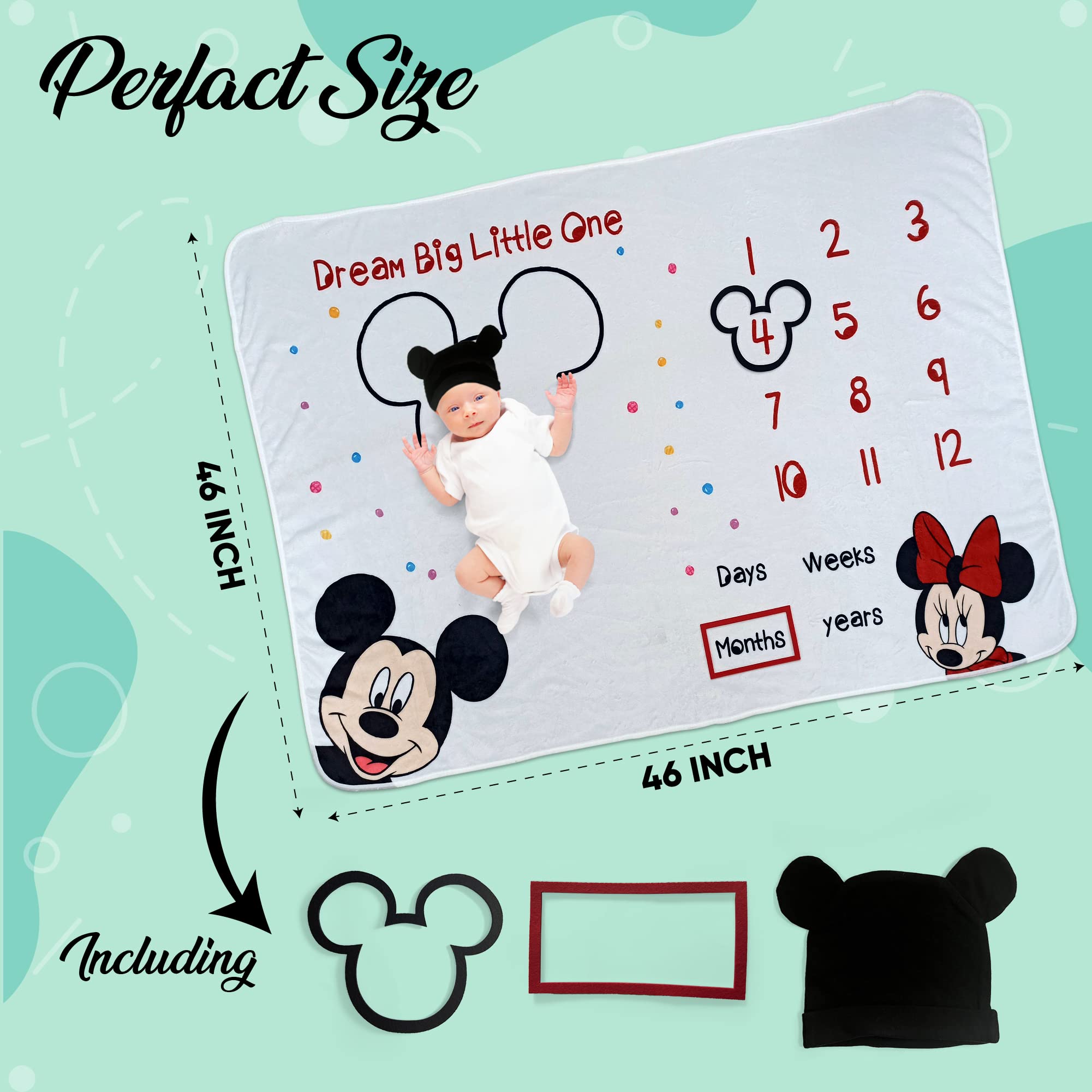 babyly milestone photo setup with blanket and frames for albums
