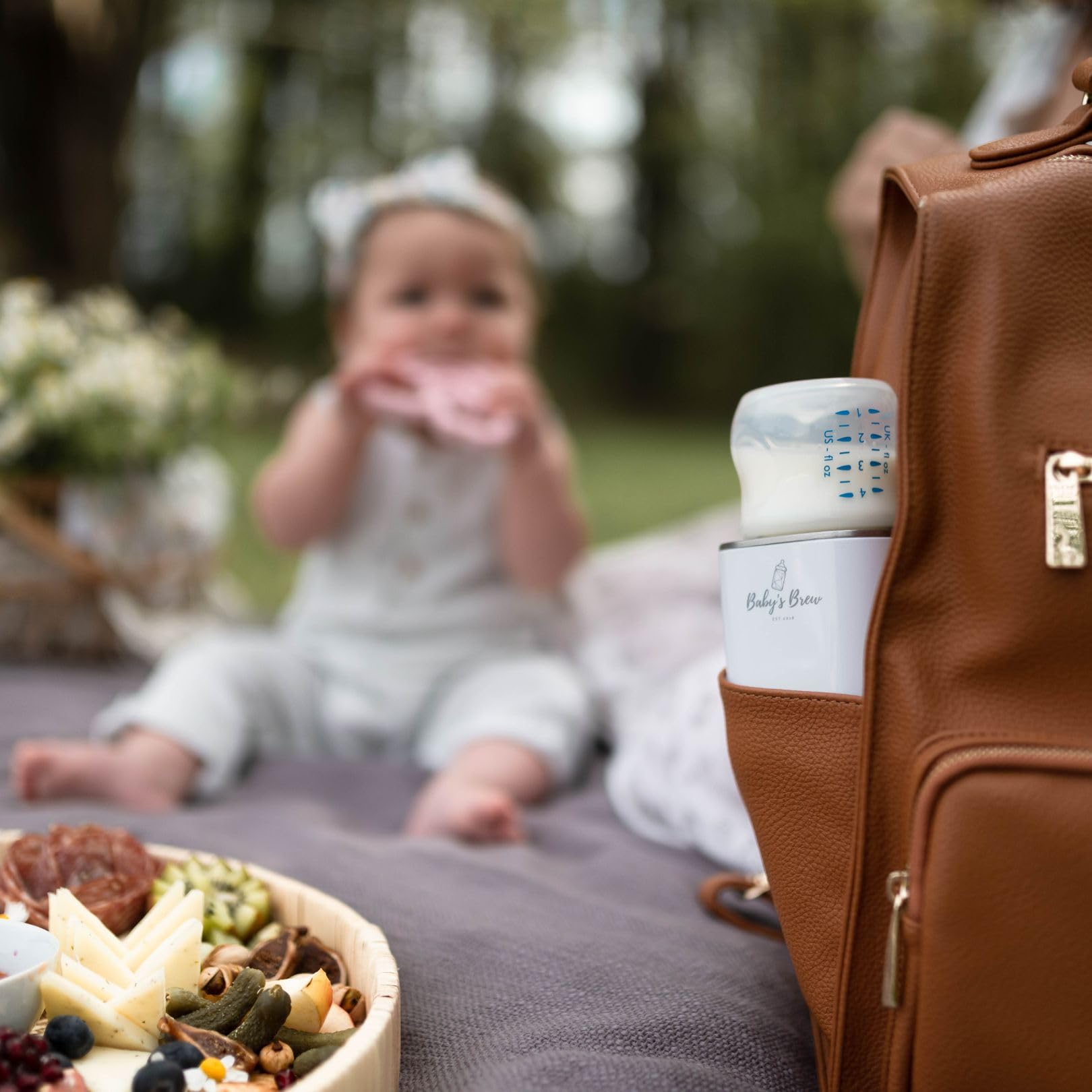 Baby’s Brew Superfast Warmer in use mid-feed on the go.