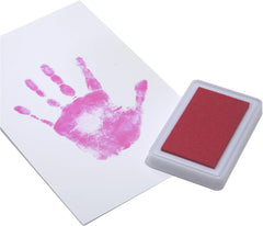 Baby's Touch pink footprint ink pad yields smudge-proof prints for memories.