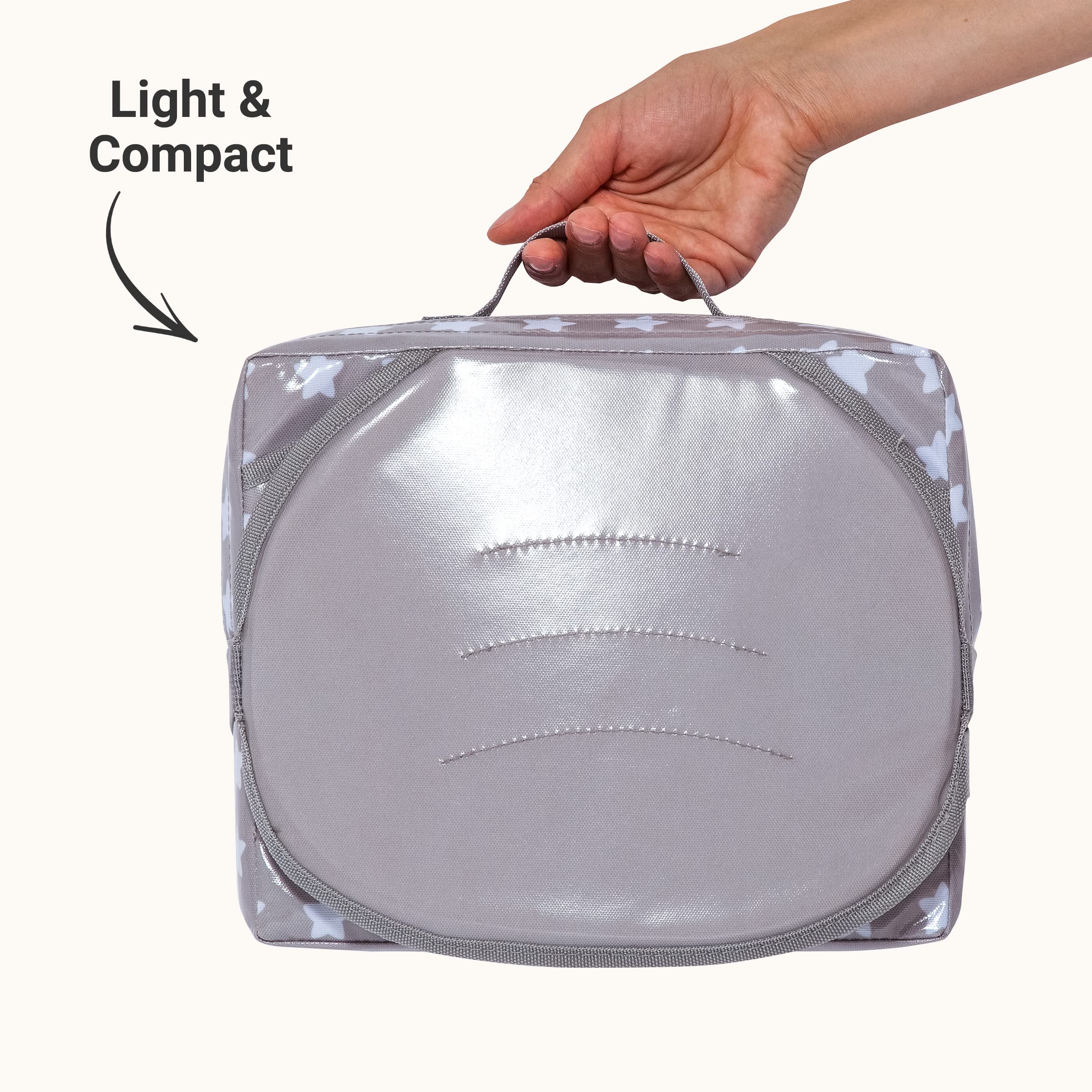 BabyToLove Easy Up booster seat with adjustable straps attaches securely to chair.